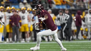 Jan 3, 2025; Charlotte, NC, USA; Virginia Tech Hokies cornerback Dante Lovett (1)  runs after his interception against the Minnesota Golden Gophers during the second half at the Duke’s Mayo Bowl at Bank of America Stadium. Mandatory Credit: Jim Dedmon-Imagn Images