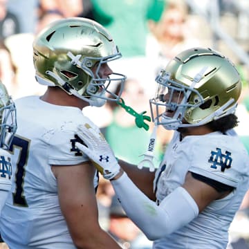 Notre Dame Fighting Irish tight end Cooper Flanagan (87) celebrates with teammates after scoring a touchdown Saturday, Sept. 14, 2024, during the NCAA football game against the Purdue Boilermakers at Ross-Ade Stadium in West Lafayette, Ind. Notre Dame Fighting Irish won 66-7.