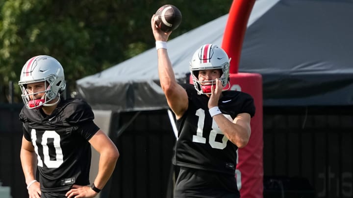 Aug 8, 2024; Columbus, Ohio, USA; Ohio State Buckeyes quarterback Will Howard (18) throws beside quarterback Julian Sayin (10) during football practice at the Woody Hayes Athletic Complex.