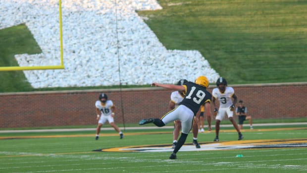 Missouri Tigers kicker Blake Craig (19) balances himself after a kick off at the team's annual fan night practice at Faurot F