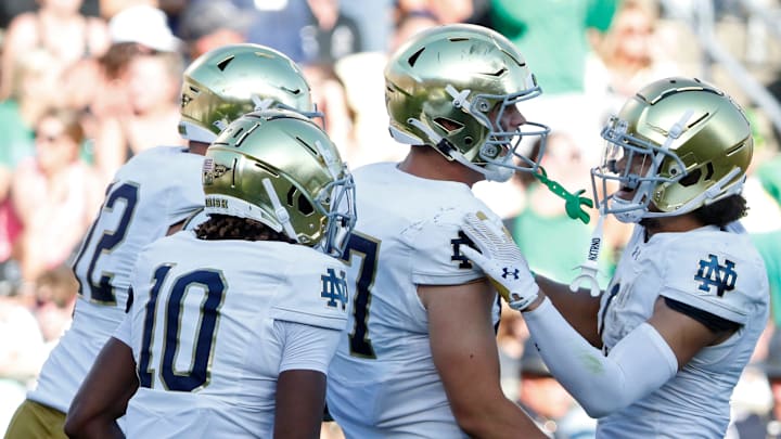 Notre Dame Fighting Irish tight end Cooper Flanagan (87) celebrates with teammates after scoring a touchdown Saturday, Sept. 14, 2024, during the NCAA football game against the Purdue Boilermakers at Ross-Ade Stadium in West Lafayette, Ind. Notre Dame Fighting Irish won 66-7.