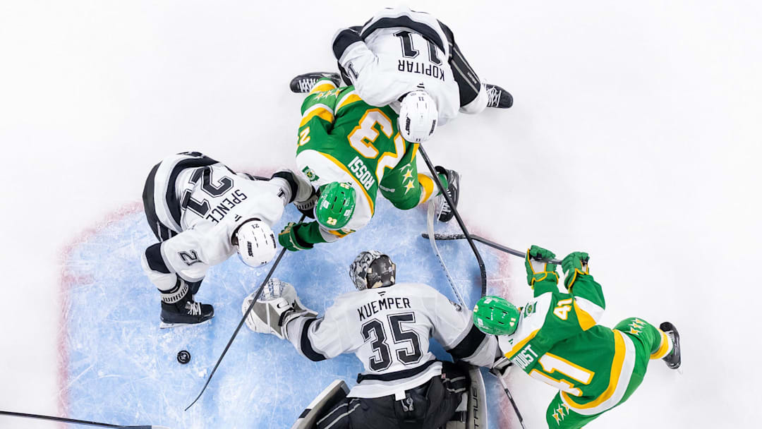 Mar 17, 2025; Saint Paul, Minnesota, USA;  Los Angeles Kings goaltender Darcy Kuemper (35) makes a save against the Minnesota Wild center Marco Rossi (23) in the third period at Xcel Energy Center.