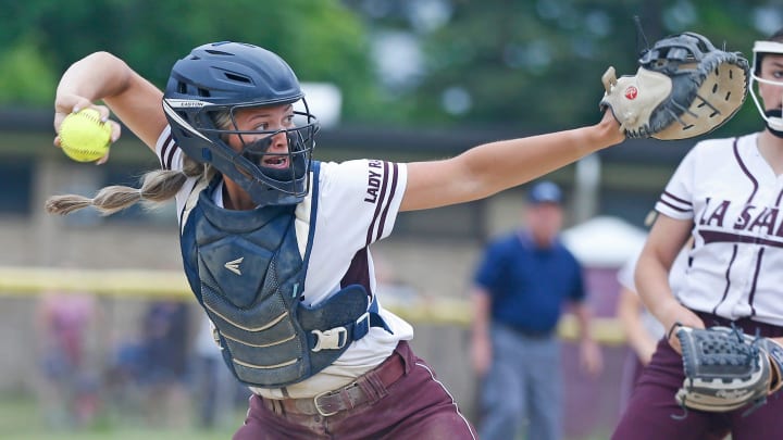 After fielding a bunt, La Salle catcher Arianna Rodi throws to first in Monday's D-I softball playoff game against Pilgrim.

C4 0992