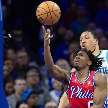Mar 1, 2024; Philadelphia, Pennsylvania, USA; Philadelphia 76ers guard Tyrese Maxey (0) drives for a shot past Charlotte Hornets forward Grant Williams (2) during the third quarter at Wells Fargo Center. Mandatory Credit: Bill Streicher-USA TODAY Sports