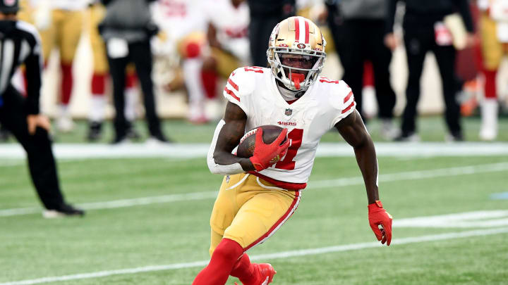 Oct 25, 2020; Foxborough, Massachusetts, USA; San Francisco 49ers wide receiver Brandon Aiyuk (11) runs with the ball against the New England Patriots during the first half at Gillette Stadium. Mandatory Credit: Brian Fluharty-USA TODAY Sports
