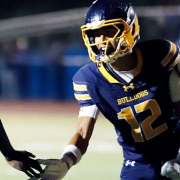 Shady Side Academy wide receiver Nico Grzymkowski, right, high-fives quarterback Javon Johnston during a 56-26 win over Burrell last Friday. The Bulldogs chose to forfeit their game against Clairton this Friday due to a lack of healthy players.