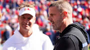Florida Gators head coach Billy Napier talks with Mississippi Rebels head coach Lane Kiffin before the start of the game at Ben Hill Griffin Stadium in Gainesville, FL on Saturday, November 23, 2024. [Doug Engle/Gainesville Sun]
