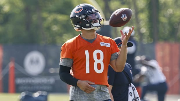 Chicago Bears quarterback Caleb Williams (18) plays with the ball during training camp at Halas Hall.