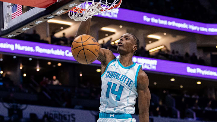 Mar 7, 2025; Charlotte, North Carolina, USA; Charlotte Hornets forward Moussa Diabate (14) dunks against the Cleveland Cavaliers during the second quarter at Spectrum Center. Mandatory Credit: Scott Kinser-Imagn Images