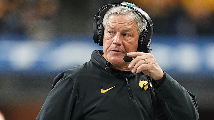 Iowa Hawkeyes head coach Kirk Ferentz walks off the field during a timeout Saturday, Dec. 2, 2023, during the game at Lucas Oil Stadium in Indianapolis.