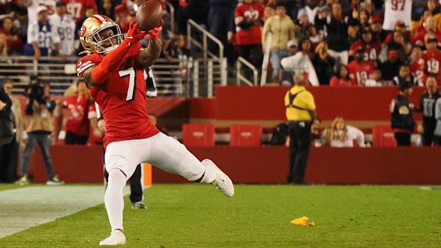 Charvarius Ward (red jersey) hauls in a pick.