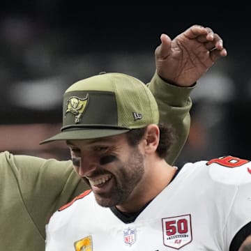 Tampa Bay Buccaneers head coach Todd Bowles and quarterback Baker Mayfield (6) celebrate a win over the New Orleans Saints