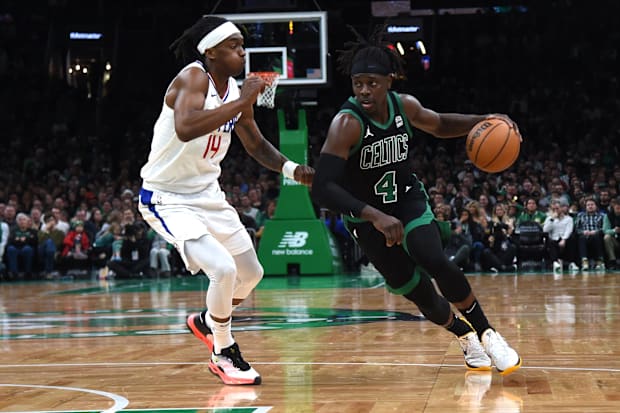 Boston Celtics guard Jrue Holiday (4) controls the ball while LA Clippers guard Terance Mann (14