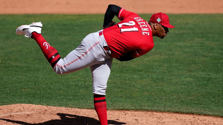 Cincinnati Reds pitcher Hunter Greene (21) delivers during a spring training game.