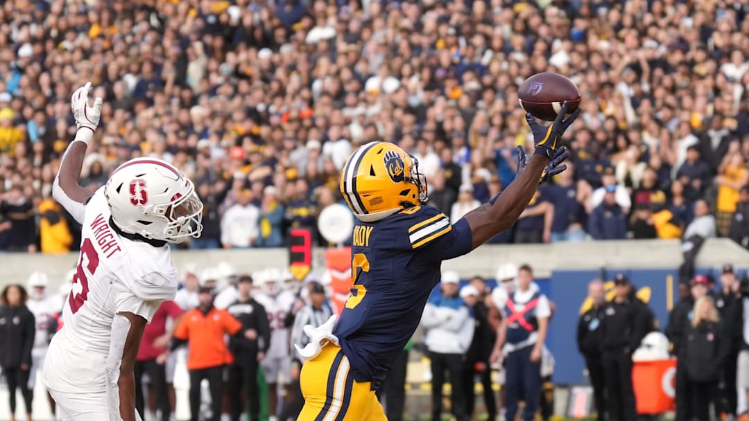 Nov 23, 2024; Berkeley, California, USA; California Golden Bears wide receiver Jonathan Brady (right) catches a touchdown pass against Stanford Cardinal cornerback Collin Wright (left) during the fourth quarter at California Memorial Stadium. Mandatory Credit: Darren Yamashita-Imagn Images
