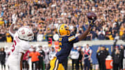 Nov 23, 2024; Berkeley, California, USA; California Golden Bears wide receiver Jonathan Brady (right) catches a touchdown pass against Stanford Cardinal cornerback Collin Wright (left) during the fourth quarter at California Memorial Stadium. Mandatory Credit: Darren Yamashita-Imagn Images