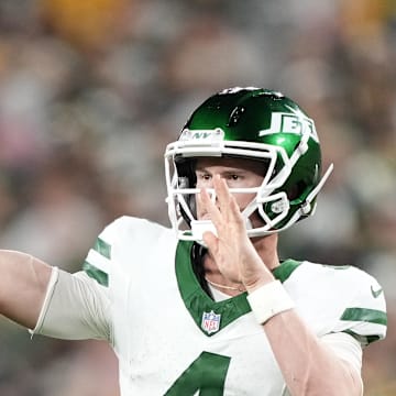 Aug 9, 2025; Green Bay, Wisconsin, USA;  New York Jets quarterback Brady Cook (4) throws a pass against the Green Bay Packers during the second quarter at Lambeau Field. Mandatory Credit: Kayla Wolf-Imagn Images