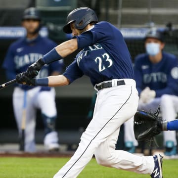 Then-Seattle Mariners catcher Austin Nola hits a home run against the Los Angeles Dodgers on Aug. 19, 2020, at T-Mobile Park.