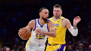 Apr 3, 2025; Los Angeles, California, USA; Golden State Warriors guard Stephen Curry (30) moves to the basket against Los Angeles Lakers guard Luka Doncic (77) during the second half at Crypto.com Arena. Mandatory Credit: Gary A. Vasquez-Imagn Images