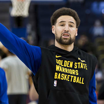 Jan 4, 2024; San Francisco, California, USA; Golden State Warriors guard Stephen Curry (30) and forward Klay Thompson (11) warm up before the game against the Denver Nuggets at Chase Center. 