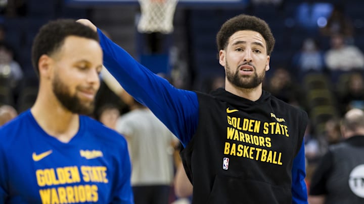 Jan 4, 2024; San Francisco, California, USA; Golden State Warriors guard Stephen Curry (30) and forward Klay Thompson (11) warm up before the game against the Denver Nuggets at Chase Center. 