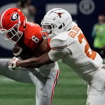 Georgia defensive back Daylen Everette (6) picks off a pass from Texas quarterback Quinn Ewers (3) for in interception during the second half of the SEC championship game against Texas in Atlanta, on Saturday, Dec. 7, 2024.
