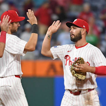 Sep 10, 2024; Philadelphia, Pennsylvania, USA; Philadelphia Phillies outfielder Cal Stevenson (47) highly fives teammates first base Kody Clemens (2) and shortstop Trea Turner (7) after win against the Tampa Bay Rays at Citizens Bank Park.