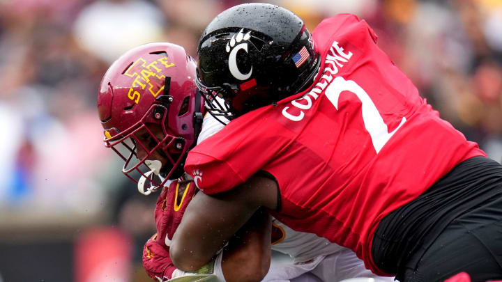 Cincinnati Bearcats defensive lineman Dontay Corleone (2) tackles Iowa State Cyclones running back Eli Sanders (6) in the fourth quarter during a college football game between the Iowa State Cyclones and the Cincinnati Bearcats Saturday, Oct. 14, 2023, at Nippert Stadium win Cincinnati. The Iowa State Cyclones won, 30-10.