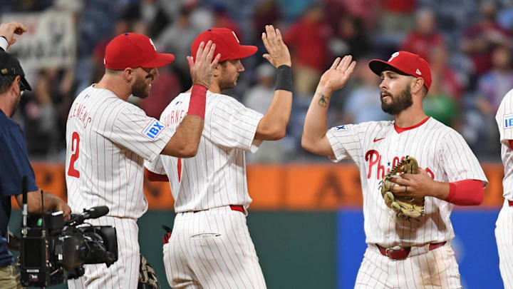 Sep 10, 2024; Philadelphia, Pennsylvania, USA; Philadelphia Phillies outfielder Cal Stevenson (47) highly fives teammates first base Kody Clemens (2) and shortstop Trea Turner (7) after win against the Tampa Bay Rays at Citizens Bank Park.