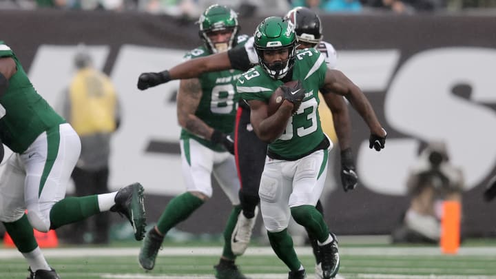 Dec 3, 2023; East Rutherford, New Jersey, USA; New York Jets running back Dalvin Cook (33) runs with the ball against the Atlanta Falcons during the first quarter at MetLife Stadium. Mandatory Credit: Brad Penner-USA TODAY Sports