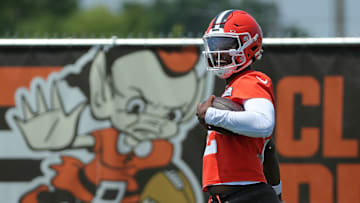 Browns quarterback Shedeur Sanders celebrates after breaking away for a big gain during practice.