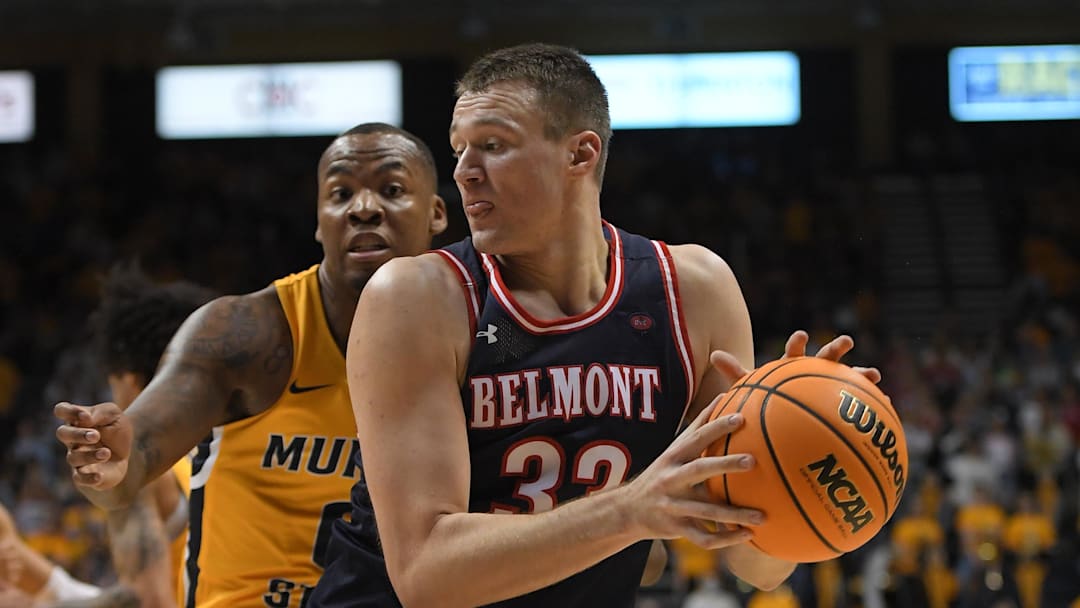 Feb 24, 2022; Murray, Kentucky, USA;  Murray State Racers forward KJ Williams (0) blocks the shot of Belmont Bruins center Nick Muszynski (33) during first half at CFSB Center. Mandatory Credit: Steve Roberts-Imagn Images