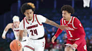 Nov 27, 2024; Paradise Island, Bahamas, BHS; Louisville Cardinals guard Chucky Hepburn (24) dribbles as Indiana Hoosiers guard Myles Rice (1) defends during the first half at the Atlantis Resort.  Mandatory Credit: Kevin Jairaj-Imagn Images