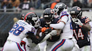Nov 9, 2025; Chicago, Illinois, USA; Chicago Bears running back D'Andre Swift (4) rushes the ball during the second half at Soldier Field.  