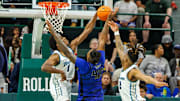 Jan 30, 2025; New Orleans, Louisiana, USA;  Memphis Tigers forward Dain Dainja (42) has a shot blocked by Tulane Green Wave forward Kaleb Banks (1) during the second half at Avron B. Fogelman Arena in Devlin Fieldhouse.