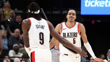 Mar 1, 2024; Memphis, Tennessee, USA; Portland Trail Blazers guard Dalano Banton (5) reacts with forward Jerami Grant (9) during the second half against the Memphis Grizzlies at FedExForum. Mandatory Credit: Petre Thomas-USA TODAY Sports