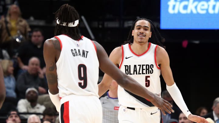 Mar 1, 2024; Memphis, Tennessee, USA; Portland Trail Blazers guard Dalano Banton (5) reacts with forward Jerami Grant (9) during the second half against the Memphis Grizzlies at FedExForum. Mandatory Credit: Petre Thomas-USA TODAY Sports