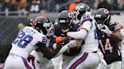 Nov 9, 2025; Chicago, Illinois, USA; Chicago Bears running back D'Andre Swift (4) rushes the ball during the second half at Soldier Field.  