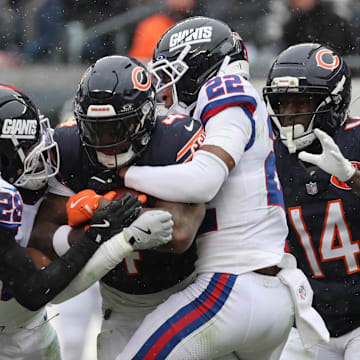 Nov 9, 2025; Chicago, Illinois, USA; Chicago Bears running back D'Andre Swift (4) rushes the ball during the second half at Soldier Field.  