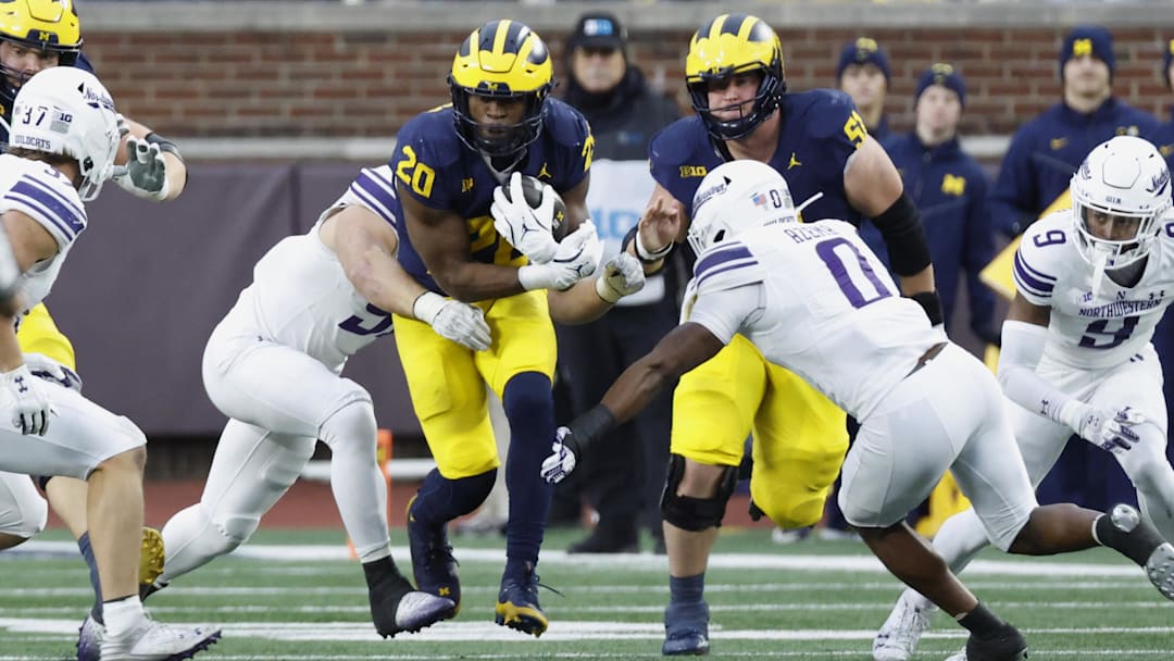 Nov 23, 2024; Ann Arbor, Michigan, USA;  Michigan Wolverines running back Kalel Mullings (20) runs the ball against the Northwestern Wildcats in the first half at Michigan Stadium. Mandatory Credit: Rick Osentoski-Imagn Images
