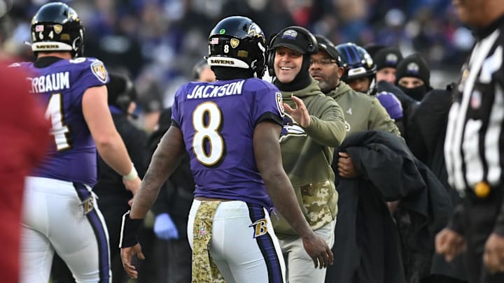 Nov 20, 2022; Baltimore, Maryland, USA;  Baltimore Ravens head coach John Harbaugh greats Baltimore Ravens quarterback Lamar Jackson (8) after scoring a second half touchdown against the Carolina Panthers  at M&T Bank Stadium.