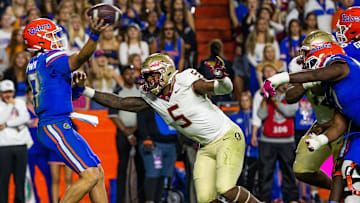 Florida State Seminoles defensive lineman Jared Verse (5) pressures Florida Gators quarterback Max Brown (17) at Steve Spurrier Field at Ben Hill Griffin Stadium in Gainesville, FL on Saturday, November 25, 2023 during the second half. Florida State won 24-15. [Doug Engle/Gainesville Sun]