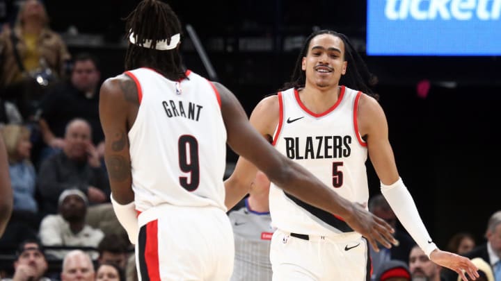 Mar 1, 2024; Memphis, Tennessee, USA; Portland Trail Blazers guard Dalano Banton (5) reacts with forward Jerami Grant (9) during the second half against the Memphis Grizzlies at FedExForum. Mandatory Credit: Petre Thomas-USA TODAY Sports