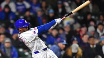Apr 20, 2024; Chicago, Illinois, USA; Chicago Cubs outfielder Alexander Canario (4) hits a home run during the sixth inning against the Miami Marlins at Wrigley Field