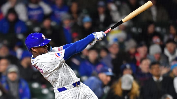 Apr 20, 2024; Chicago, Illinois, USA; Chicago Cubs outfielder Alexander Canario (4) hits a home run during the sixth inning against the Miami Marlins at Wrigley Field