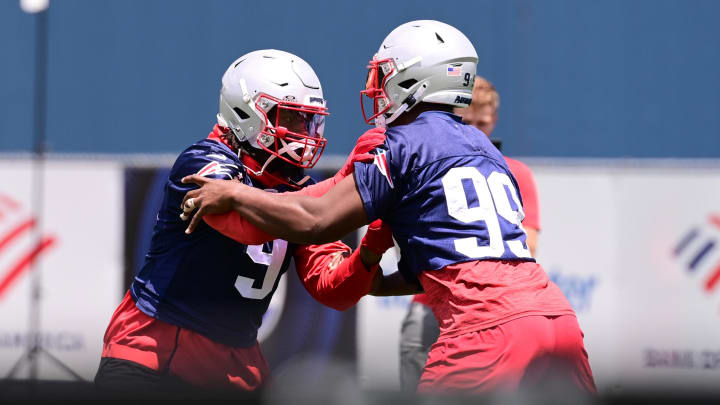 Jun 10, 2024; Foxborough, MA, USA; New England Patriots linebacker Matthew Judon (9) works with defensive end Keion White (99) at minicamp at Gillette Stadium. Mandatory Credit: Eric Canha-USA TODAY Sports