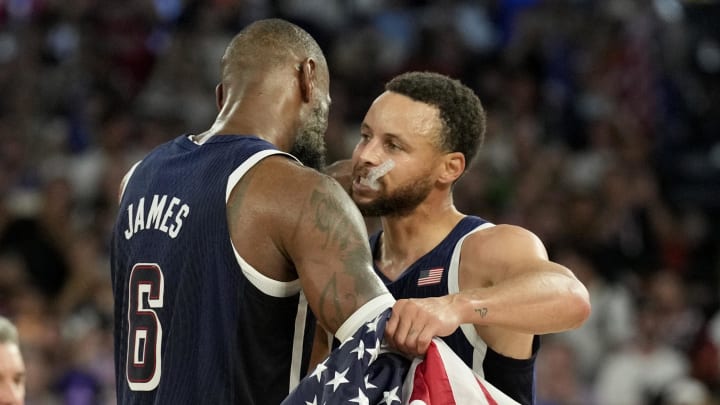 Aug 10, 2024: Steph Curry and LeBron James celebrate after defeating France.