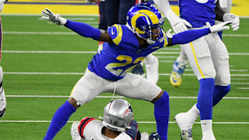 Dec 10, 2020; Inglewood, California, USA; Los Angeles Rams cornerback Troy Hill (22) signals incomplete pass after breaking up a pass play to New England Patriots wide receiver Damiere Byrd (10) during the first quarter at SoFi Stadium. Mandatory Credit: Robert Hanashiro-Imagn Images