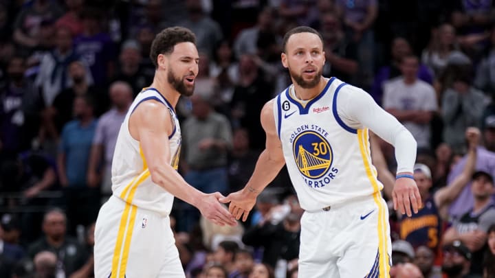 Apr 26, 2023; Sacramento, California, USA; Golden State Warriors guard Stephen Curry (30) is congratulated by guard Klay Thompson (11) after making a basket against the Sacramento Kings in the fourth quarter during game five of the 2023 NBA playoffs at the Golden 1 Center. Mandatory Credit: Cary Edmondson-USA TODAY Sports