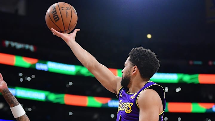 Feb 9, 2024; Los Angeles, California, USA; Los Angeles Lakers guard Skylar Mays (4) shoots against New Orleans Pelicans forward Brandon Ingram (14) during the first half at Crypto.com Arena. Mandatory Credit: Gary A. Vasquez-Imagn Images